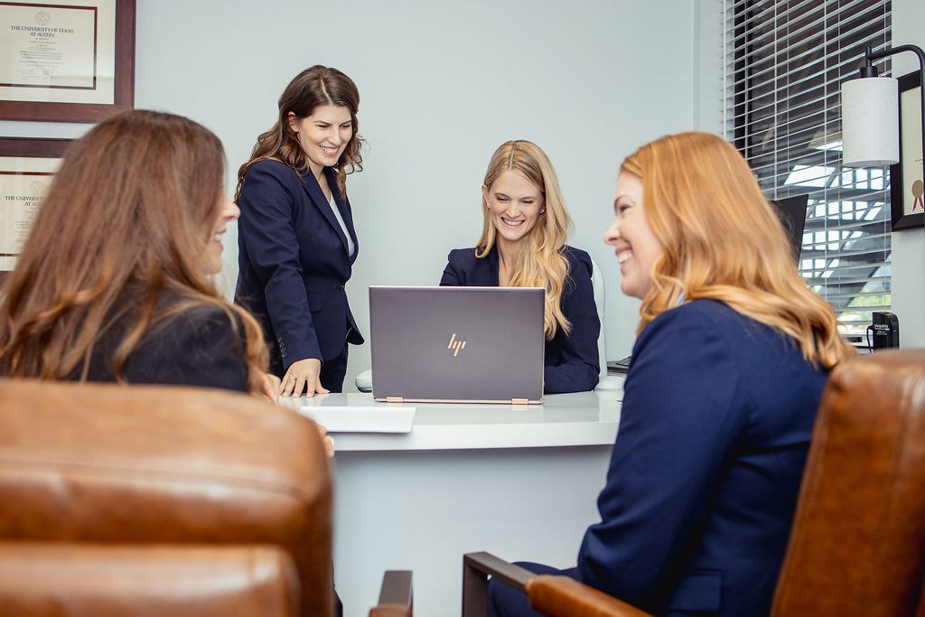 LOAR PLLC team members working together at a desk
